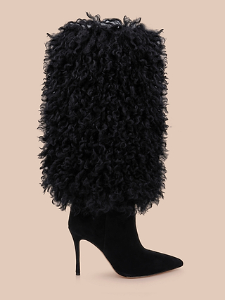 Introducing the Sheridan Boot: a striking black mid-calf boot with a pointed toe and high heel, featuring a shaft enveloped in thick, curly textured faux fur. Displayed against a plain beige background.