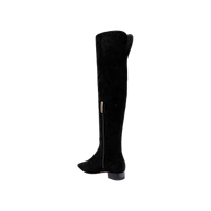 The Grand Boot is a chic black suede over-the-knee boot featuring a low block heel and convenient side zipper, shown in profile against a plain white background. This elegant style is ideal for anyone searching for comfortable, stylish boots with the sophistication of premium black suede.