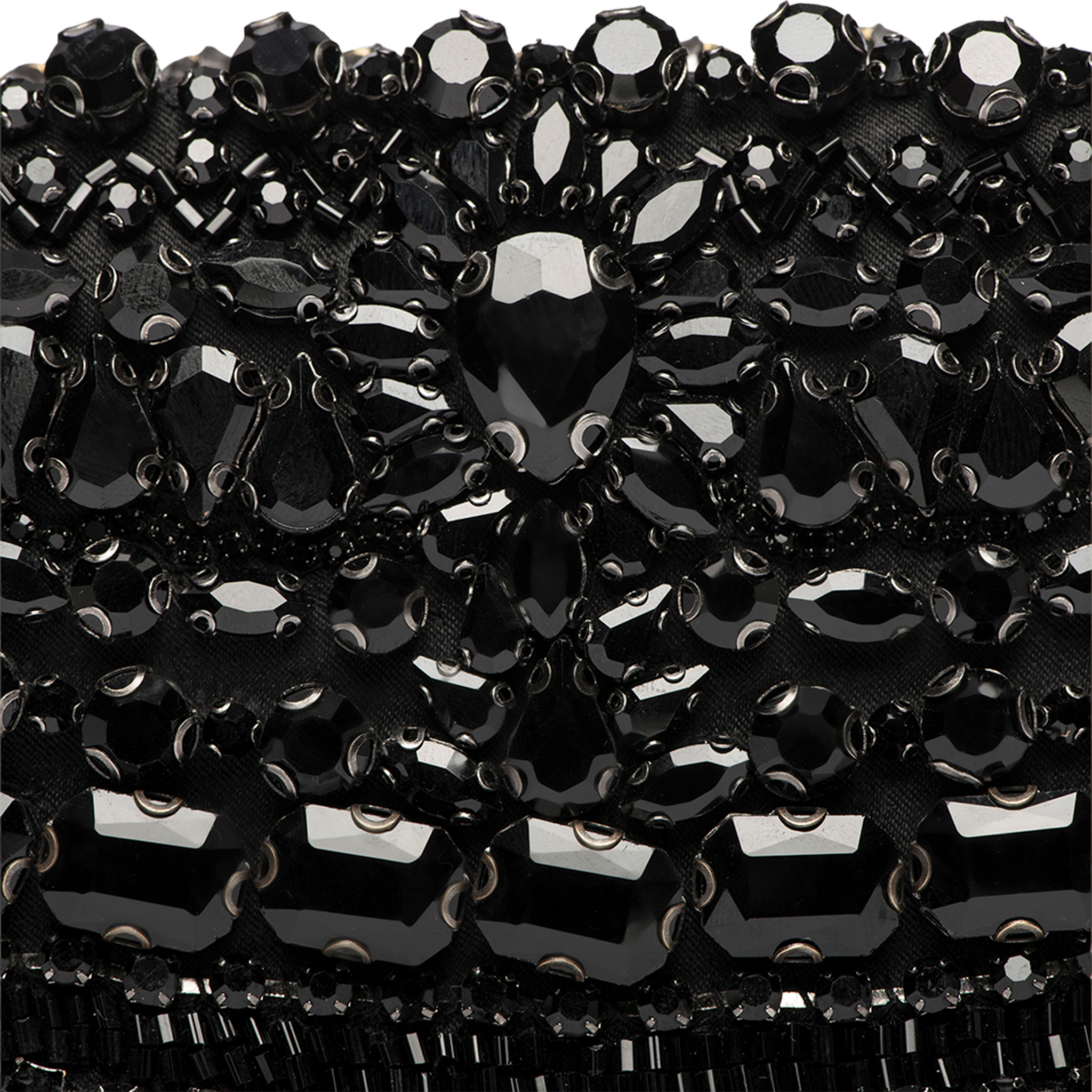 Close-up of the Eclipse Crystal Clutch, featuring an ornate, textured pattern crafted from black beads and sequins. Various shapes and sizes of shiny black gems create a luxurious design, reminiscent of artisanal craftsmanship.