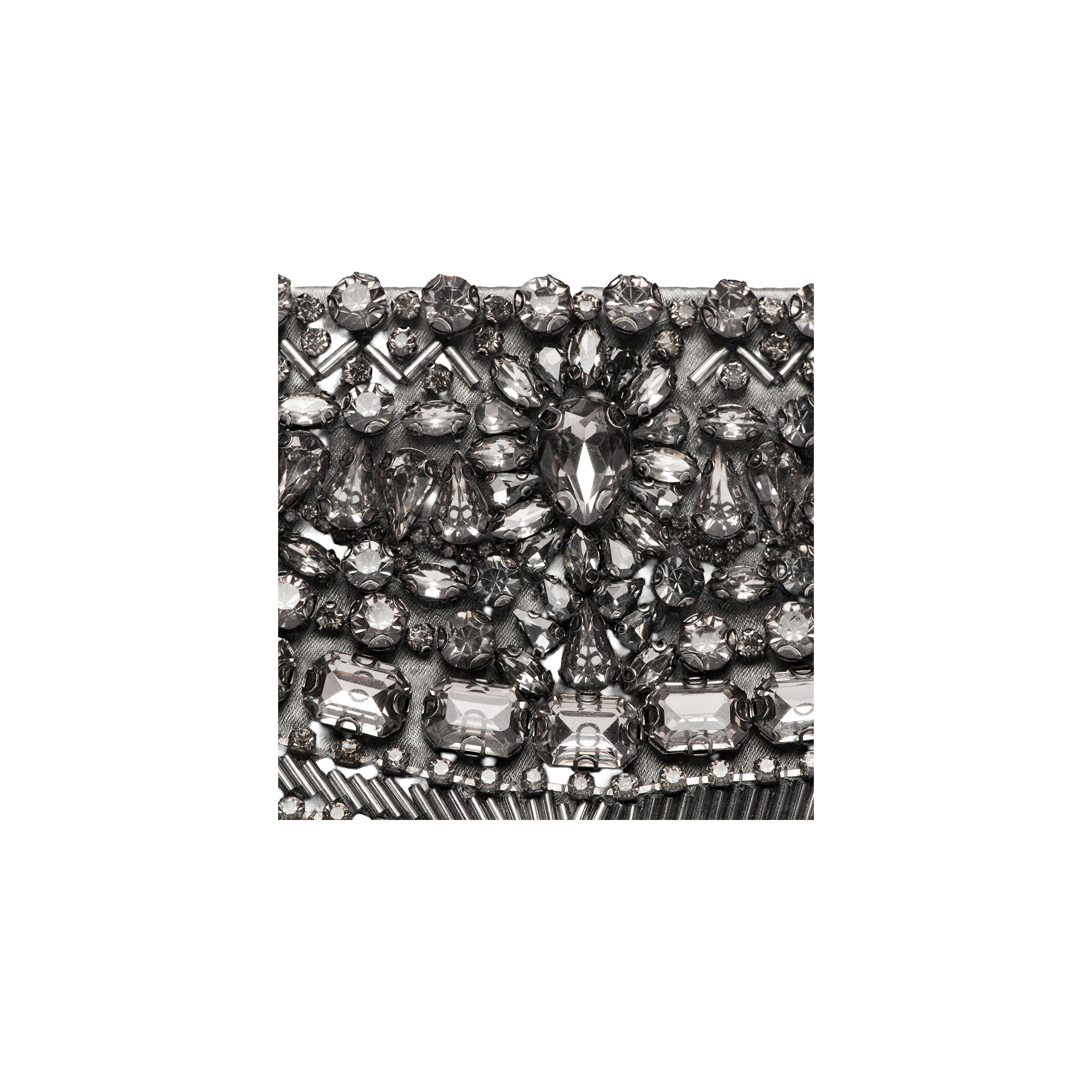 Close-up of the Eclipse Crystal Clutch, showcasing an intricate, symmetrical pattern of various shapes and sizes of silver and clear rhinestones. The sparkling crystal embellishments make this decorative surface perfect for an elegant evening accessory.