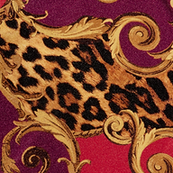 A close-up of the Emilia Bandeau One-Piece Swimsuit, featuring leopard print fabric adorned with ornate gold baroque swirls on a vibrant red and magenta background, inspired by its signature bandeau design.