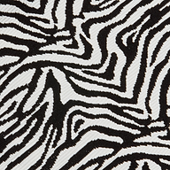 Close-up of the Karmin One-Piece Swimsuit fabric featuring bold, irregular zebra stripes and a slightly ribbed texture that enhances its striking, natural-inspired design.