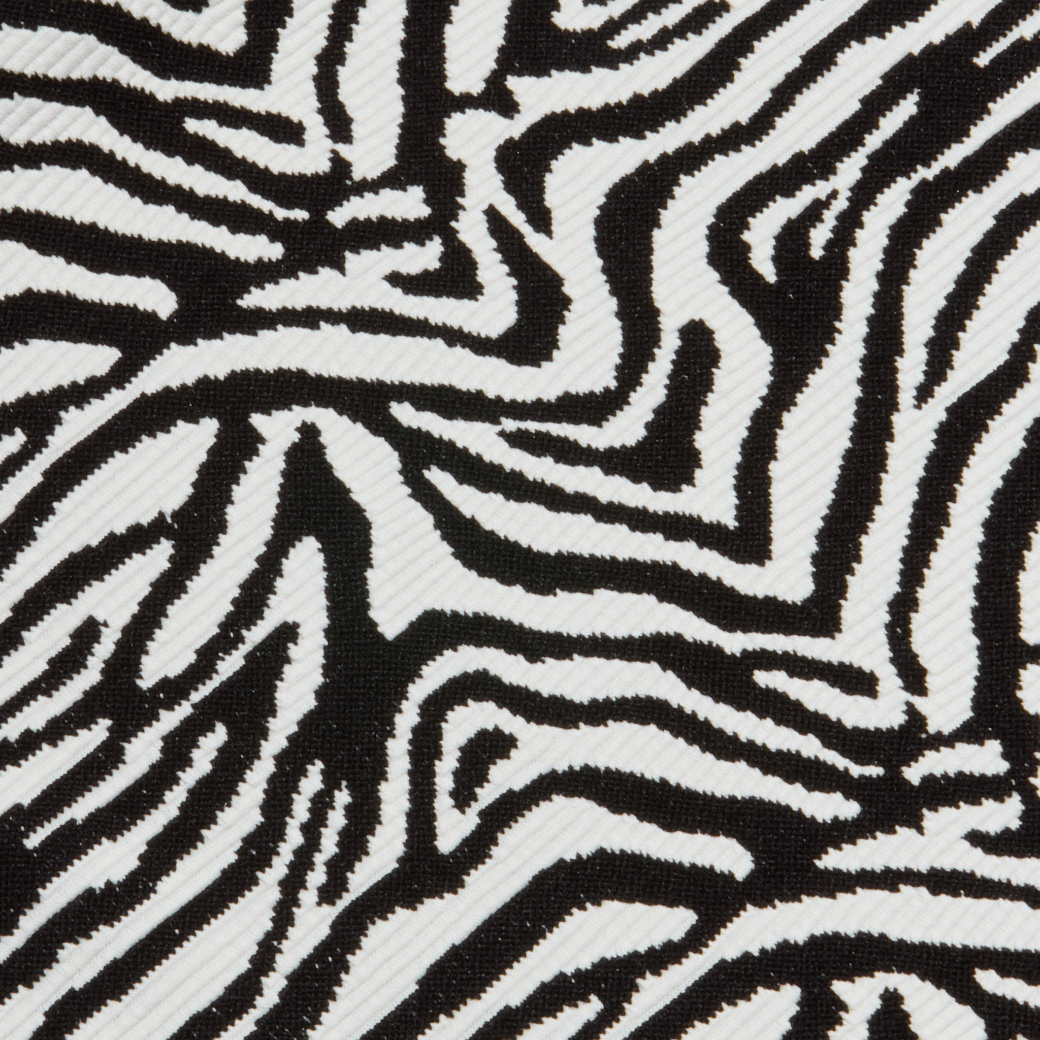 Close-up of the Nicole Bikini Bottom showcasing bold, irregular black and white zebra stripes and offering moderate coverage.
