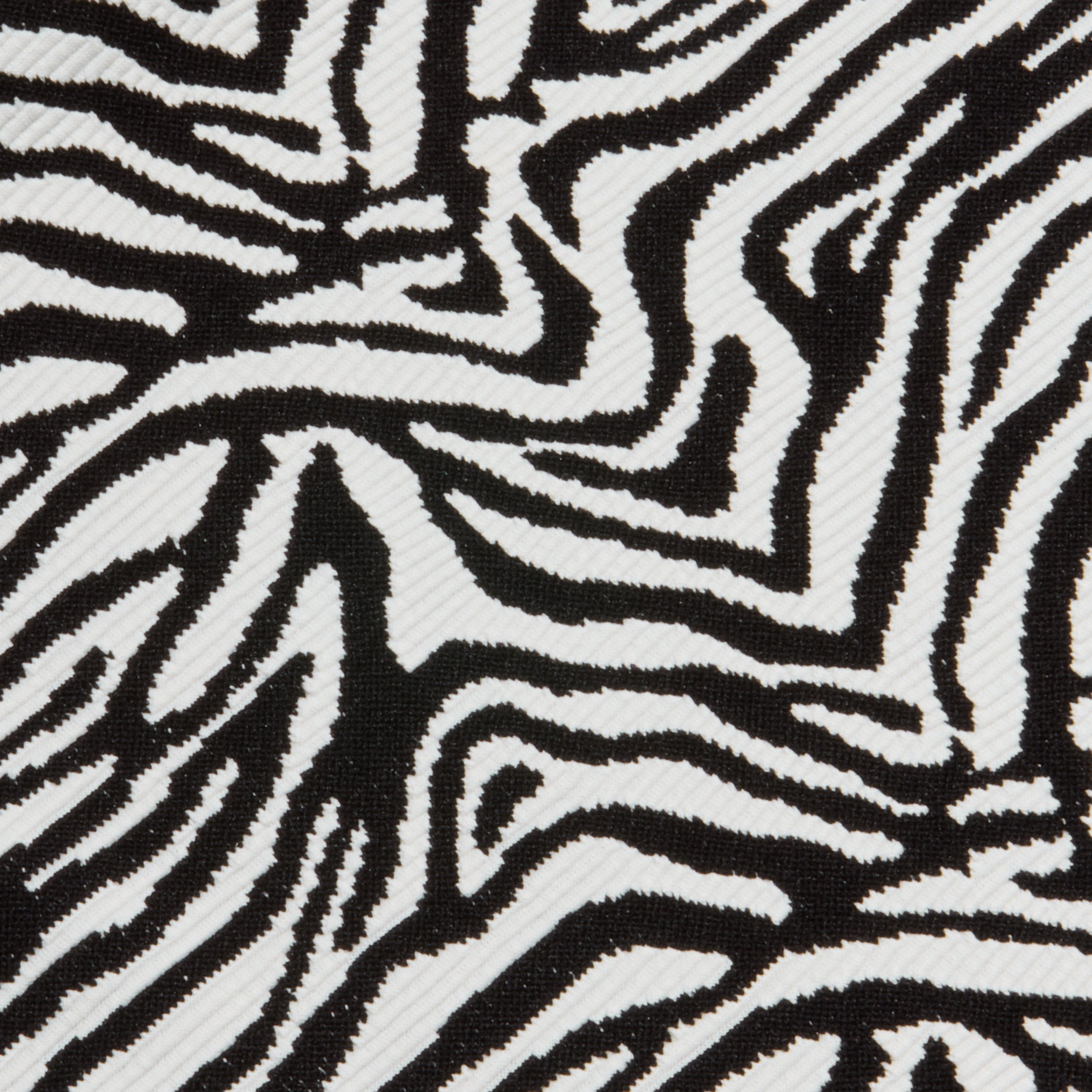 Close-up of the Nicole Bikini Bottom showcasing bold, irregular black and white zebra stripes and offering moderate coverage.