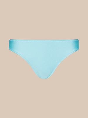 The Nicole Bikini Bottom is shown from the front in ice blue against a plain beige background, made from smooth stretch nylon fabric with UPF 50 protection and a clean, pattern-free design.