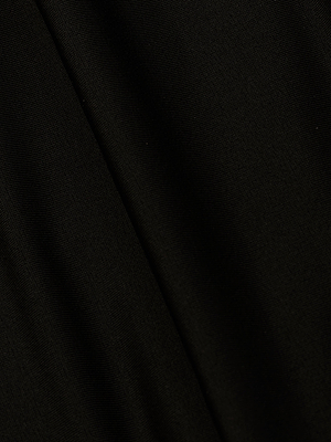 A close-up of the Emelia Bandeau One-Piece Swimsuit's smooth black four-way stretch nylon, featuring subtle folds and gentle diagonal lines across its surface.