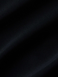 Close-up of black fabric with visible diagonal ribbing and gentle folds, highlighting the texture and subtle sheen—ideal for the Gianna Brazilian Bikini Bottom with its mid-rise fit and cheeky cut.