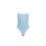 The Tory Bandeau One-Piece Swimsuit features a light blue textured bouclé fabric with white trim, thin adjustable straps, and side button details, displayed against a plain white background.