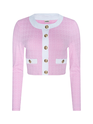 The Adaline Cardigan Cover-Up is a long-sleeve, light pink cropped cardigan featuring a white collar, white trim, textured bouclé fabric, two front pockets, and gold decorative buttons down the front.