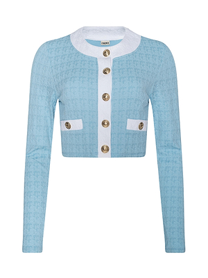 The Adaline Cardigan Cover-Up is a powder blue, long-sleeved, cropped jacket with a white round collar, gold buttons, vertical white trim, and two decorative white-trimmed pockets—ideal for chic beach layering.