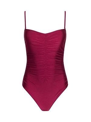 The Aubrey Ruched One-Piece Swimsuit is a burgundy one-piece with adjustable straps and front shirring, featuring a smooth fitted design, shown against a white background.