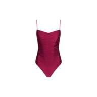 The Aubrey Ruched One-Piece Swimsuit, shown against a plain white background, is crafted from four-way stretch nylon in burgundy and features thin spaghetti straps along with textured shirring down the front.