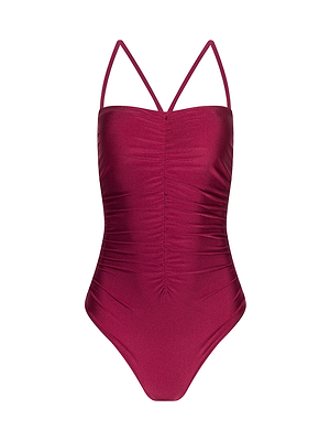 The Aubrey Ruched One-Piece Swimsuit showcases a magenta design with adjustable straps and center ruching, presented on a plain white background.