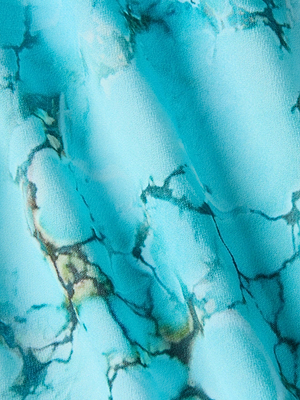 The Umma Cover-Up Dress by L'AGENCE Sale features a light blue surface with dark blue and brown marbled patterns—an abstract, flowing design perfect for adding poolside glam.