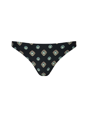 The Jean Bikini Bottom features a low-rise cut and high leg, with a repeating geometric print in green, blue, and beige. The symmetrical design is evenly spaced across the fabric.