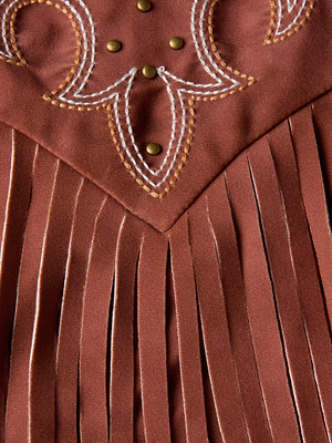 Close-up of the Adeline Cardigan Cover-Up by L'AGENCE Sale, featuring suede-look fabric, decorative white and yellow stitching, bronze studs, and long vertical fringe.