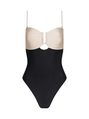 The Emilia Bandeau One-Piece Swimsuit by L'AGENCE features a beige ruched bust, thin straps, a black bottom half, and a small cutout below the bust, shown on a white background.