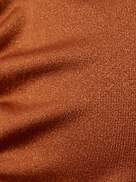 Close-up of brown, textured fabric with visible weave pattern and slight wrinkles on the Annabelle Triangle Bikini Top, creating a sense of depth and softness—perfect for an adjustable fit or luxe hardware details.