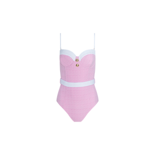 The Amie Bandeau One-Piece Swimsuit is a pink bouclé nylon swimsuit with thin straps, white trim on the bust and waist, and a gold button accent at the center of the chest. This UPF 50 swimwear combines stylish details and sun protection, shown here against a plain white background.