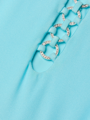 Close-up of the Indore One-Piece Swimsuit in ice blue, featuring silver crystal pavé rings—some with clear crystals—and blue fabric loops threaded through the rings.