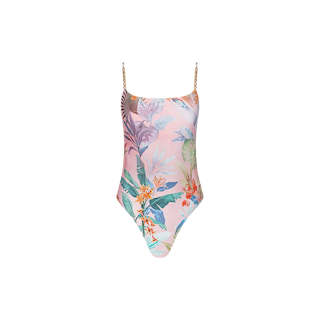 The Remi One-Piece Swimsuit showcases a pastel pink background adorned with a vibrant tropical floral and palm leaf print. It features thin gold chain straps, a scoop neckline, and a flattering high-leg cut.