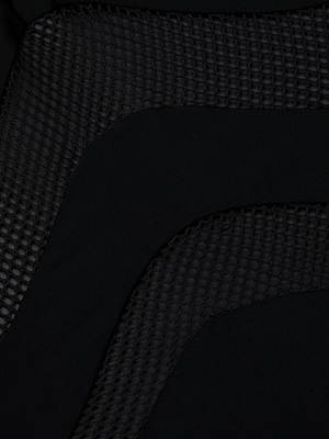Close-up of Gabrielle One-Piece Swimsuits black fabric, showcasing curved, layered patterns. Mesh insets add a grid-like texture that contrasts with smooth solid sections for a bold, stylish look.