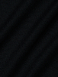 Close-up of dark black mesh fabric with a subtle diagonal weave and gentle folds—ideal for the Ambala Mesh Cover-Up Top to enhance your beachside style.