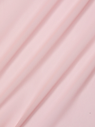 The Ambala Cover-Up Top features light pink sheer mesh fabric with soft diagonal folds, creating gentle shadows and a smooth, textured surface.