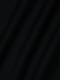 Close-up of the black Mahe Mesh Cover-Up Skirts textured fabric, featuring subtle diagonal folds that evoke a mermaid skirt—ideal for a chic poolside look.