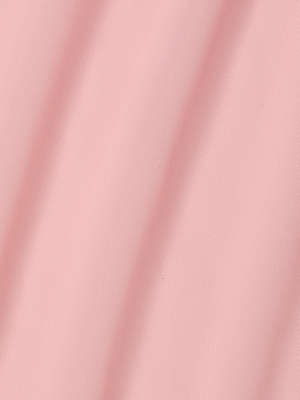 Close-up of light pink Mahe Mesh Cover-Up Skirt fabric with gentle diagonal folds, creating soft shadows and a smooth, textured look—ideal for a stylish poolside layer or a chic mermaid-inspired skirt.