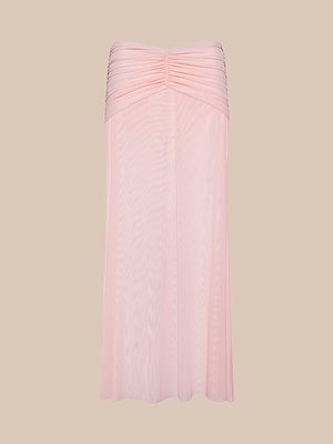 A light pink Mahe Mesh Cover-Up Skirt with a flowy, semi-sheer mermaid silhouette and ruched detailing, displayed on a plain beige background.