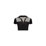 The Anastasia Swim Top is a black short-sleeve polo featuring a collar, three brown buttons, and black-and-white checkered panels on the shoulders and upper chest, adding a touch of beachside sophistication to your wardrobe.