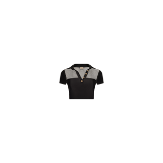 Experience beachside sophistication with the Anastasia Swim Top—a black short-sleeve polo featuring a checkered collar and upper chest panel, button placket, and a fitted silhouette. Designed with UPF 50 protection, this top is displayed on a plain white background.