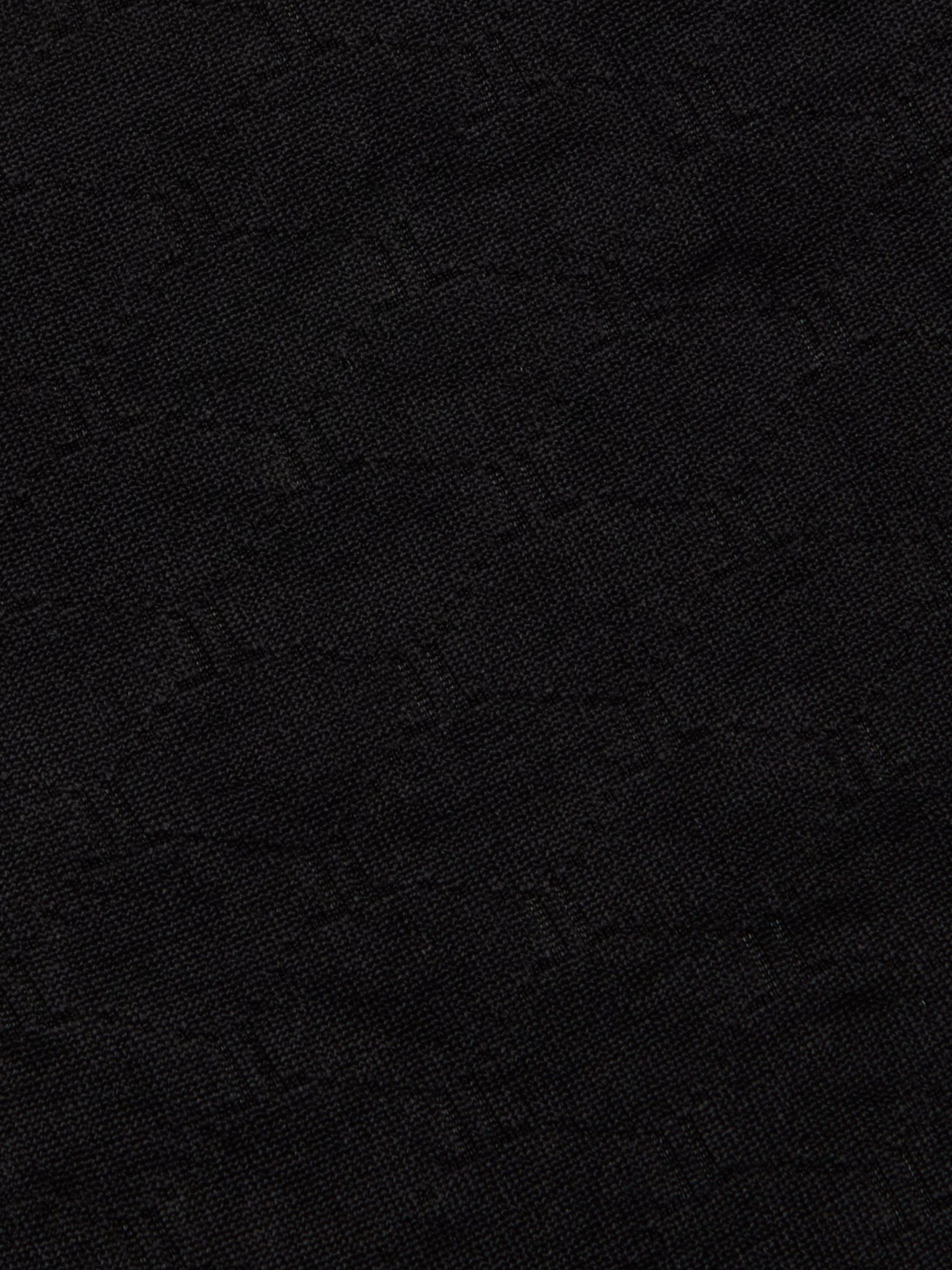 Close-up of the Annabelle Bikini Top crafted from dark black fabric with a subtle, woven geometric pattern and a slightly textured surface—perfect for UPF 50 swimwear or a chic black triangle bikini with an adjustable fit.