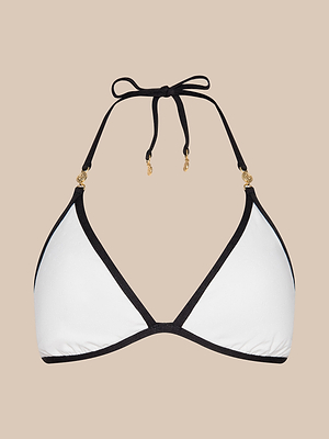 The Annabelle Bikini Top features a white triangle silhouette with black trim, black halter neck ties, and gold strap accents. Adjustable for comfort and style, its shown against a plain beige background.