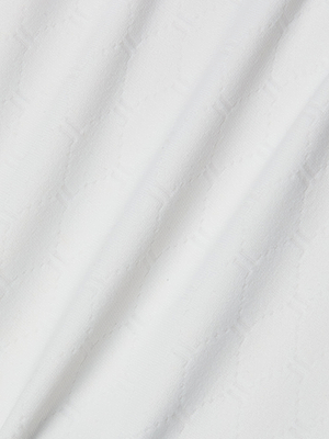 Close-up of the Violet String Bikini Bottom’s white fabric, featuring a subtle geometric pattern and gentle folds that provide moderate coverage and a soft, shadowed texture.