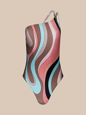 The Karmin One-Piece Swimsuit features a retro swirl print in brown, pink, coral, black, and light blue on beige with a left single strap and gold accent. UPF 50 fabric provides stylish sun protection for swimming or lounging.