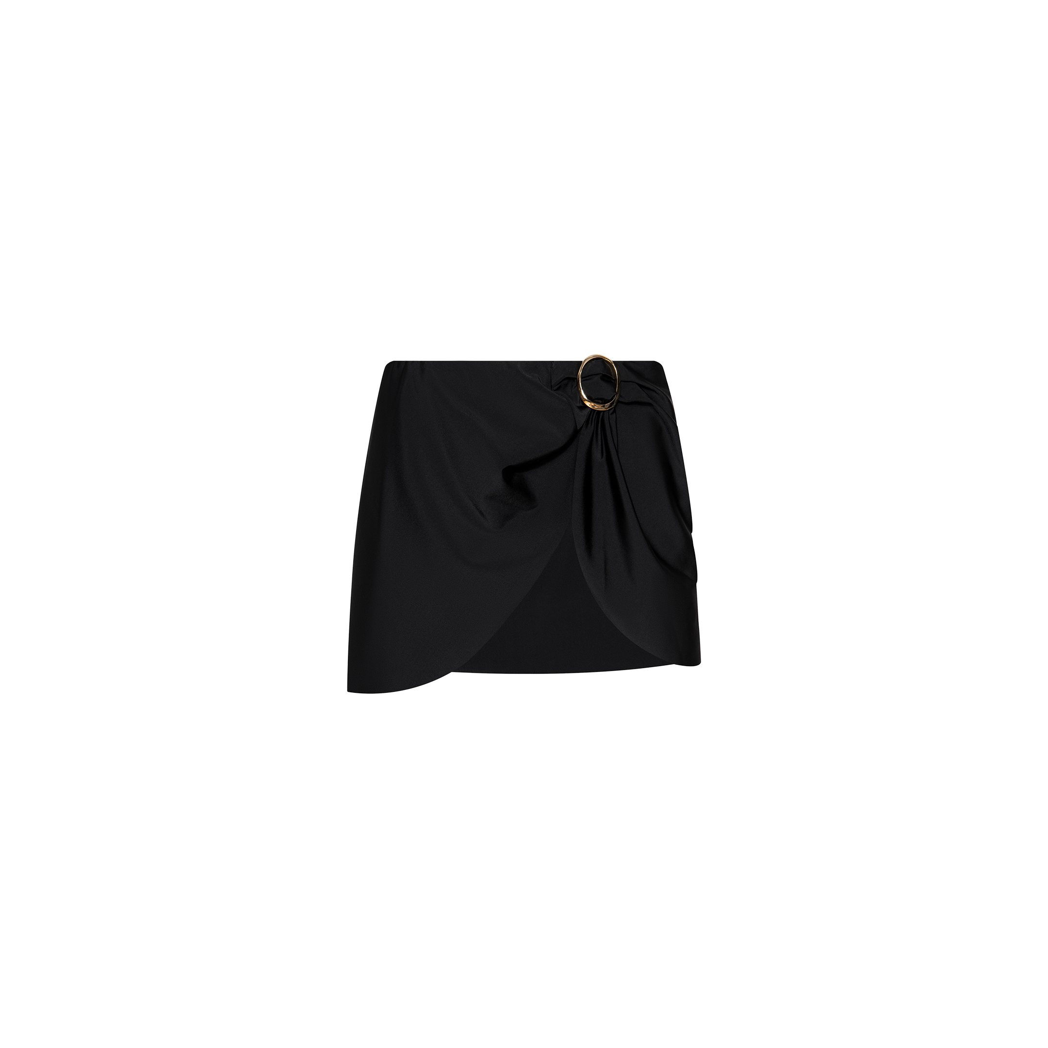 The Chandra Cover-Up Skirt is a black mini with an asymmetrical hem and side draping, accented by a decorative gold hardware buckle on the waistband. Displayed against a plain white background.