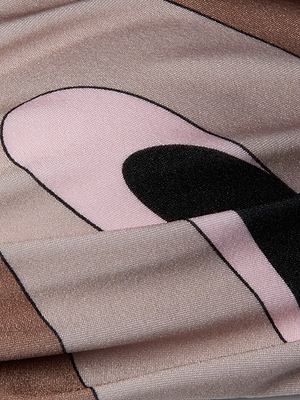 A close-up of the Krysta Halter Bikini Top shows slightly wrinkled fabric with cartoon-like black, pink, brown, and beige abstract swirls.