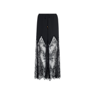 A Sharon Cover-Up Pant in black, featuring sheer lace panels and intricate floral lace detailing, designed with a drawstring waist and scalloped hem, displayed against a plain white background.