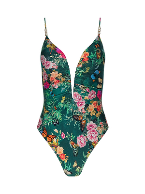 The Lilou One-Piece Swimsuit features a deep V neckline, high-leg cut, and thin straps with decorative beads, set on a green background with vibrant floral-butterfly print.