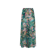 The Sharon Cover-Up Pant features a green base adorned with a vibrant floral print in shades of pink, yellow, and orange. Lightweight and perfect for beachwear, these flowy pants offer a gathered waistband resembling a drawstring for extra comfort.