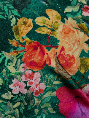 The Lexie Bikini Top by L'AGENCE features a colorful butterfly floral print with bold orange, pink, and red flowers and green leaves on a dark green background, plus a slightly raised weave for added style and dimension.