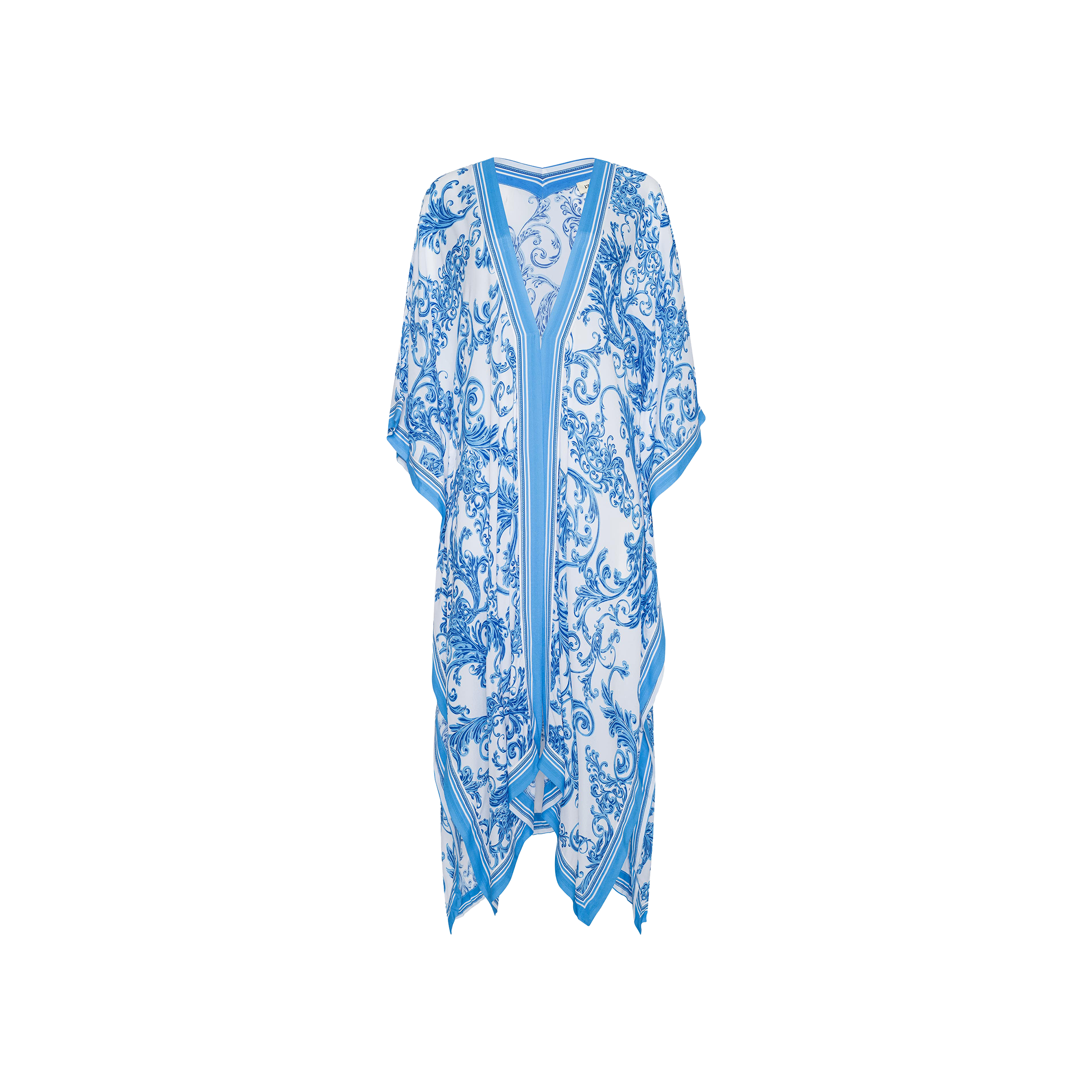 The Kara Kimono Cover-Up is a blue and white patterned kaftan with short sleeves and a V-neck, showcasing an ornate floral design and an asymmetric hem. Crafted from water-safe viscose crepe, this blue baroque cover-up offers a lightweight, flowy feel that makes it perfect for beachwear. Displayed on a plain white background.
