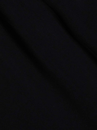 The Klaire Cover-Up Skirt features solid black viscose chiffon with subtle diagonal folds and a soft texture, creating gentle shadows across its surface.