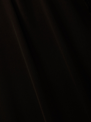 A close-up of black sheer viscose chiffon with subtle folds and gentle shading creates a soft, textured look—ideal for the Adonis Cover-Up Pant, perfect for elegant poolside style.