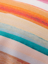 Close-up of the Annabelle Triangle Bikini Top fabric, featuring horizontal, retro-inspired stripes in orange, red, yellow, teal, and light blue tones. The visible texture highlights the weave and vibrant pattern.