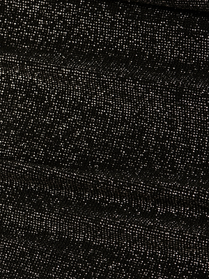 A close-up of the Nicole Bikini Bottom’s textured metallic black fabric, featuring small white dots in a shimmering pattern. Made from UPF 50 stretch nylon, it blends Parisian glamour with protective swimwear style.