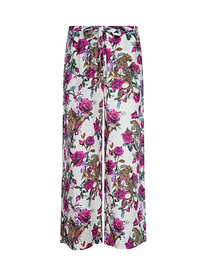 The Geraldine Cover-Up Pant features wide-leg linen with a white base, adorned with a bold rose leopard and floral print in pink, green, and brown shades—perfect for resort wear.