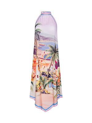 The Elise Cover-Up Dress is a sleeveless, halter midi dress with a vibrant scenic postcard print of palm trees, houses, and coastal views in pink, orange, green, and blue tones.
